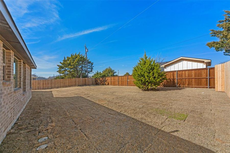 View of fenced backyard