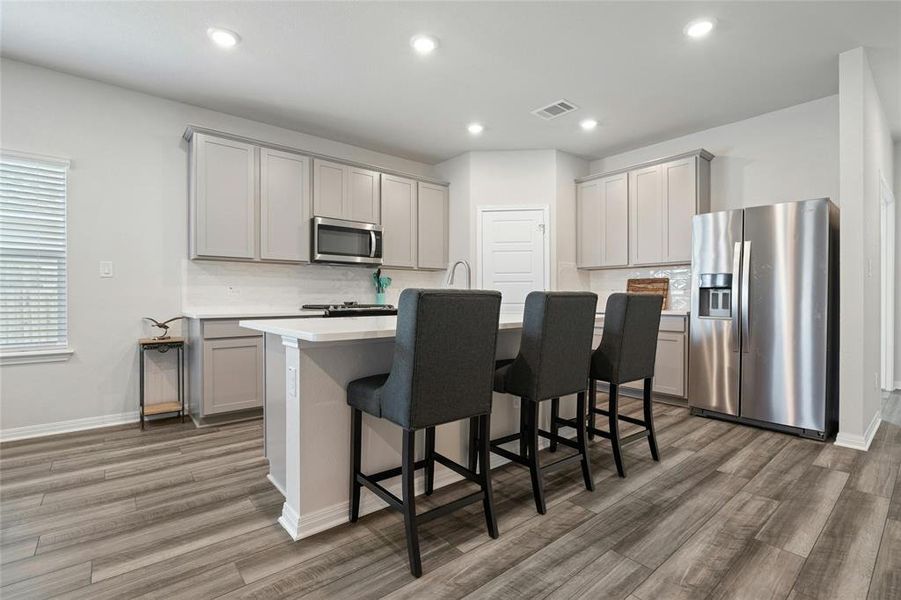 Plenty of Room for 3 or 4 Barstools Around this Kitchen Island.