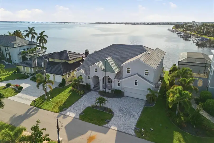 Front exterior of a new home in , Punta Gorda, FL, highlighting curb appeal (Image 1). Front exterior of a new home in , Punta Gorda, FL, highlighting curb appeal (Image 1).