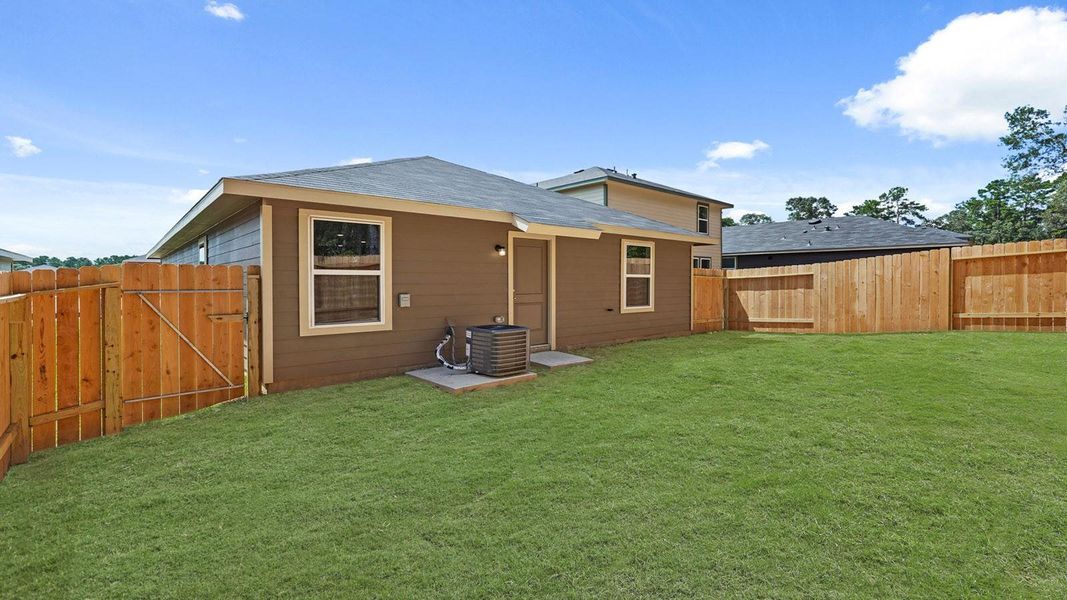 Front exterior of a new home in McCrorey Trails, Conroe, TX, highlighting curb appeal (Image 14).