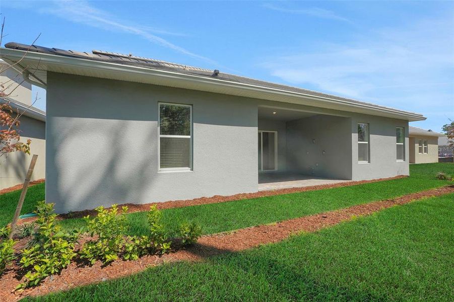 Exterior details and patio area of a home in Palms at Windermere, Windermere (Image 3).
