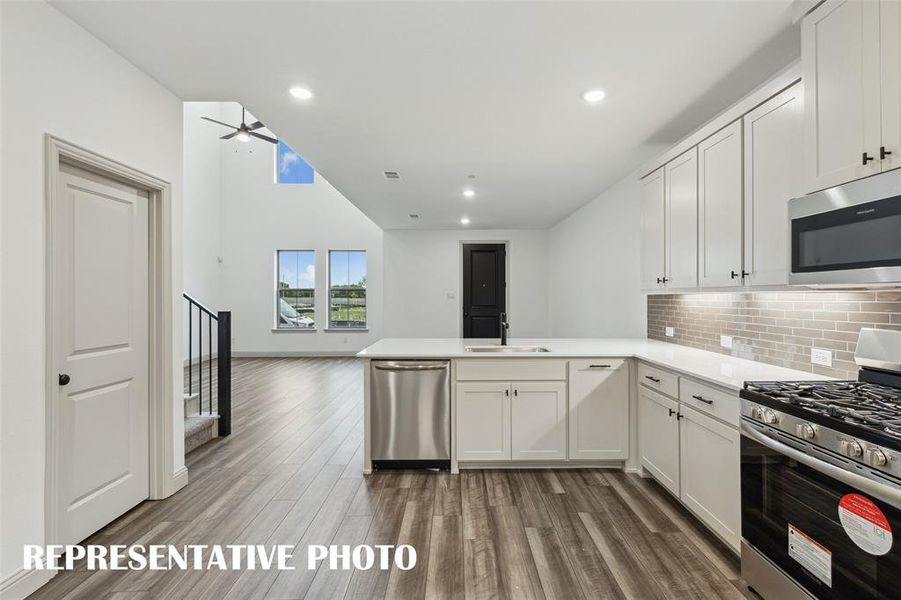 The kitchen peninsula with breakfast bar makes this the perfect place to grab a quick bite. REPRESENTATIVE PHOTO The kitchen peninsula with breakfast bar makes this the perfect place to grab a quick bite. REPRESENTATIVE PHOTO