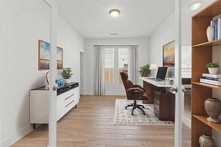 Step into this bright and welcoming home office, an ideal space for quiet focus, creativity, or managing your daily tasks. Featuring warm wood-look tile flooring, crisp neutral walls, and tall windows that bring in beautiful natural light, this room feels open, calm, and inspiring. Thoughtfully arranged furnishings highlight the generous size of the space, making it perfect for working from home or creating a cozy study area. *Virtually Staged*