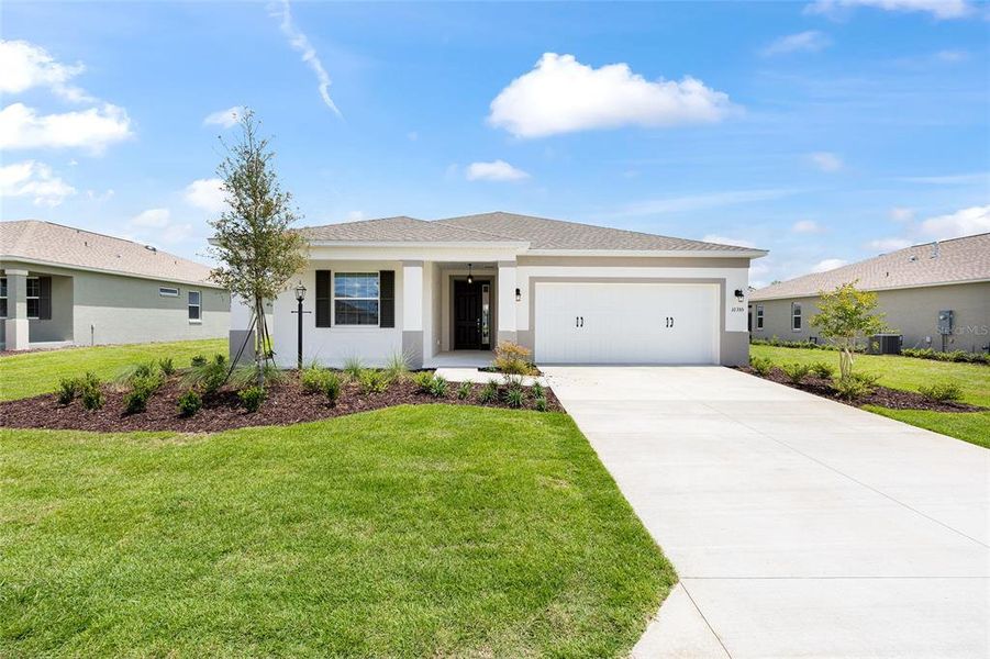 Front exterior of a new home in , Ocala, FL, highlighting curb appeal (Image 17). Front exterior of a new home in , Ocala, FL, highlighting curb appeal (Image 17).