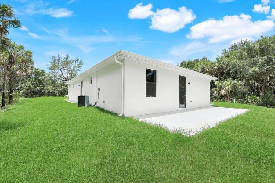 Front exterior of a new home in , Naples, FL, highlighting curb appeal (Image 13).