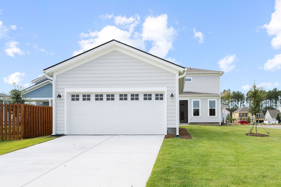 Front exterior of a new home in Heartwood, Richmond Hill, GA, highlighting curb appeal (Image 27).