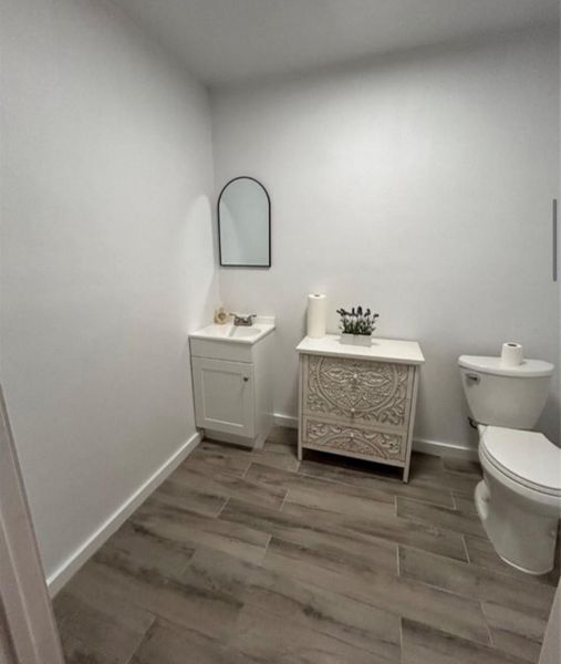 Half bath with tile flooring Half bath with tile flooring
