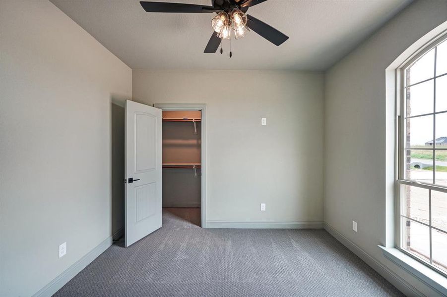 Secondary bedroom with walk-in closet.