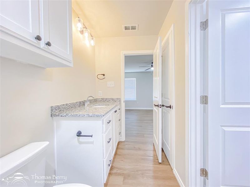 Bathroom with light wood finished floors and vanity Bathroom with light wood finished floors and vanity