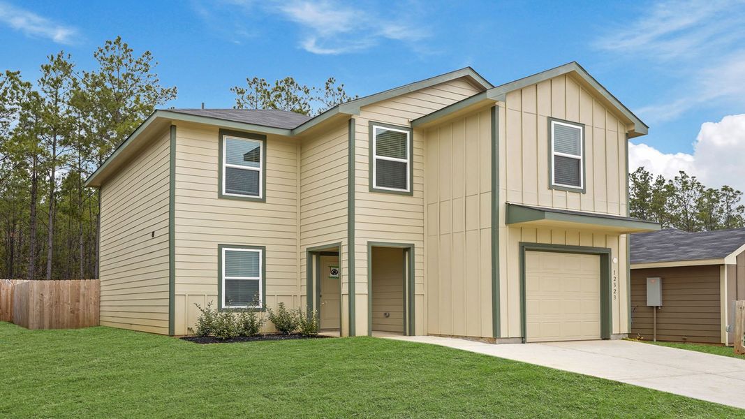 Front exterior of a new home in McCrorey Trails, Conroe, TX, highlighting curb appeal (Image 18).