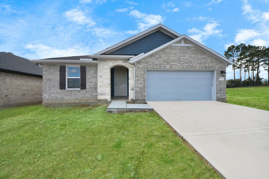 Actual exterior of home, construction - 90% complete. Glass front door, landscaping and perimeter fence pending installation. Actual exterior of home, construction - 90% complete. Glass front door, landscaping and perimeter fence pending installation.