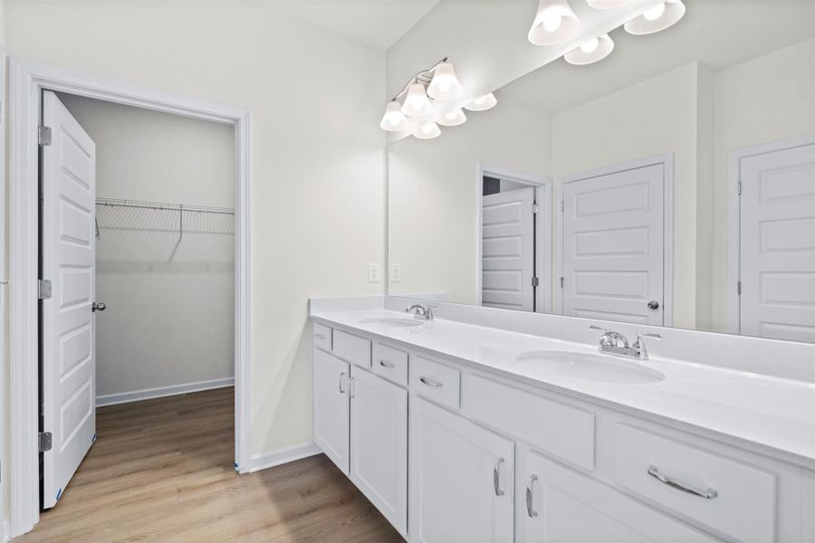 The Dove- Primary Suite with Dual Vanities. Home under construction, photo used for illustrative purposes only, colors and options will vary.
