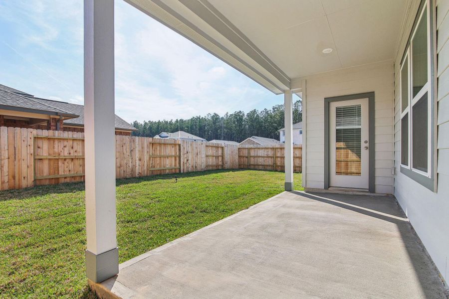Exterior details and patio area of a home in Landing Meadows - Premier Series, New Caney (Image 3).
