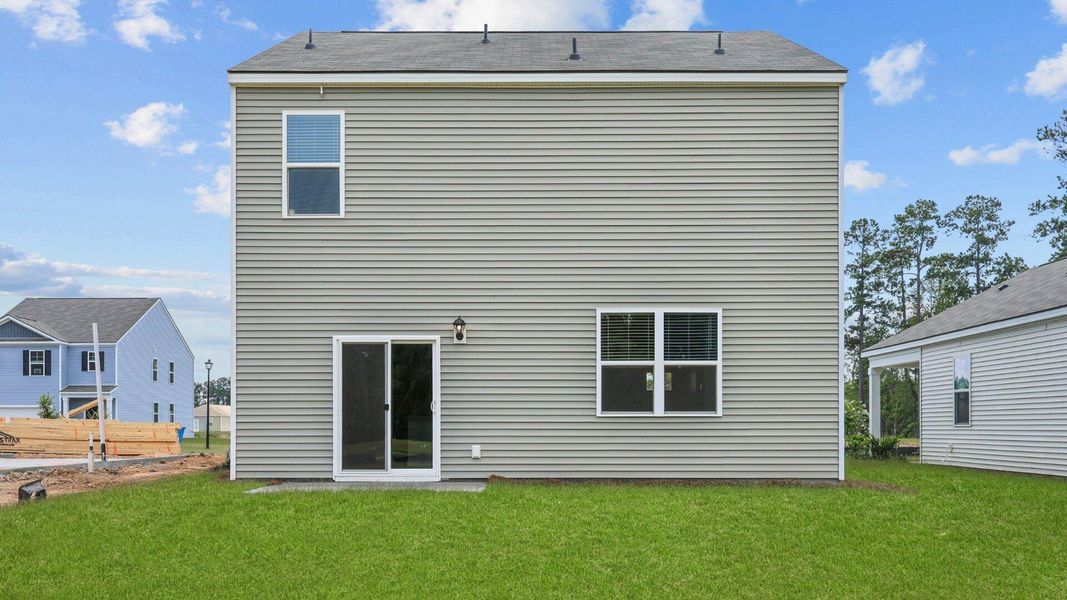 Exterior details and patio area of a home in Pine Hills at Cane Bay, Summerville (Image 17).