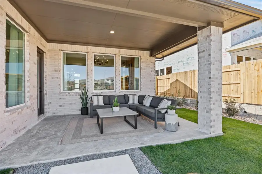 Exterior details and patio area of a home in Lariat, Liberty Hill (Image 28).