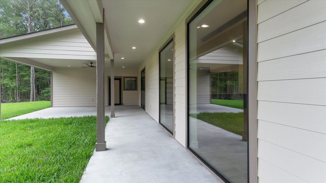 Exterior details and patio area of a home in , Conroe (Image 21).