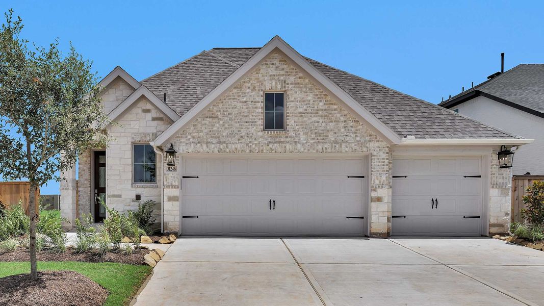 Representative exterior photo of a completed home built from the 2263W by Perry Homes in Veramendi, New Braunfels, TX (Image 13).