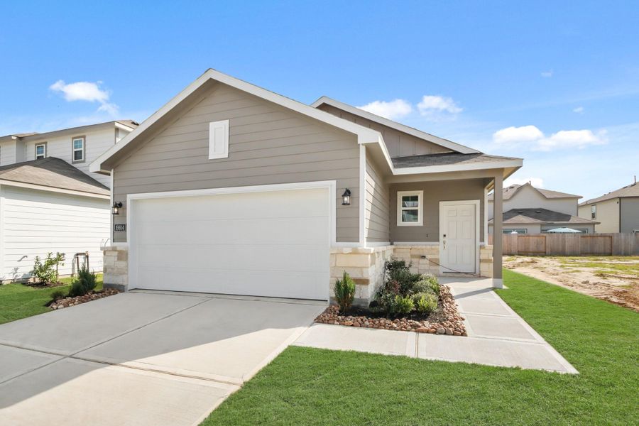 Front exterior of a new home in Northpark South, Porter, TX, highlighting curb appeal (Image 2). Front exterior of a new home in Northpark South, Porter, TX, highlighting curb appeal (Image 2).