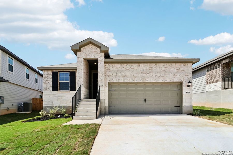 Front exterior of a new home in Lark Canyon, New Braunfels, TX, highlighting curb appeal (Image 25).