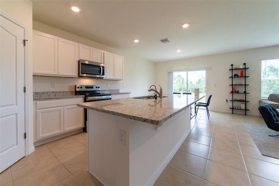 Furnished interior view inside a new home in , Harmony (Image 36).