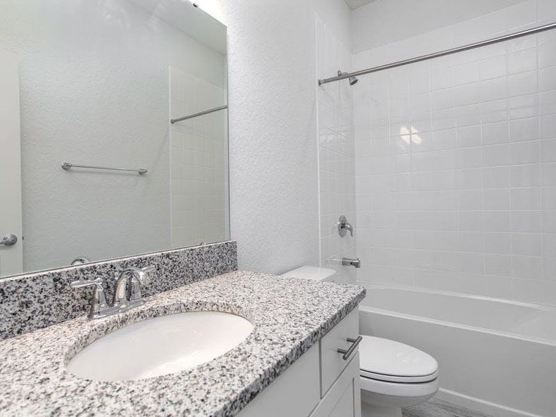 And, a hall bath serves the other bedrooms and guests - Willow II by Highland Homes And, a hall bath serves the other bedrooms and guests - Willow II by Highland Homes