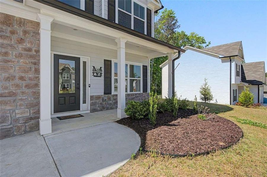 Exterior details and patio area of a home in Traditions at Cedarcrest, Dallas (Image 23).