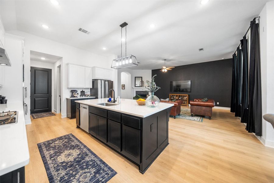 Beautiful UPGRADED EXTENDED island with MORE cabinet space. Did I mention great family gathering space?