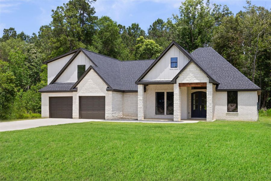 Front exterior of a new home in , Dayton, TX, highlighting curb appeal (Image 2). Front exterior of a new home in , Dayton, TX, highlighting curb appeal (Image 2).