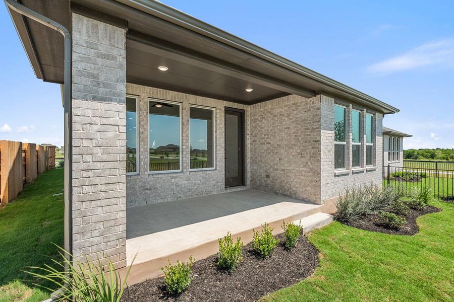Front exterior of a new home in Flora, Hutto, TX, highlighting curb appeal (Image 23).