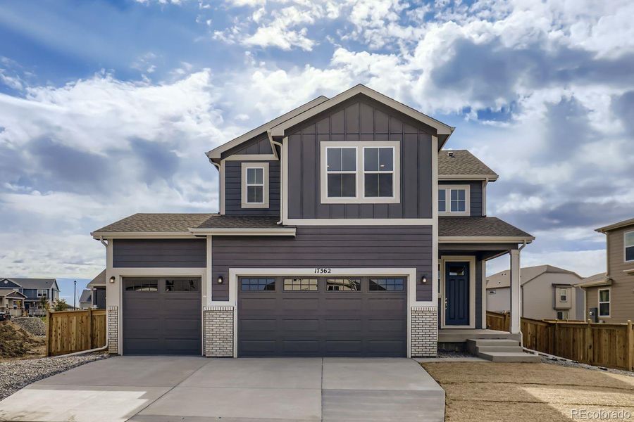 Front exterior of a new home in , Commerce City, CO, highlighting curb appeal (Image 1).