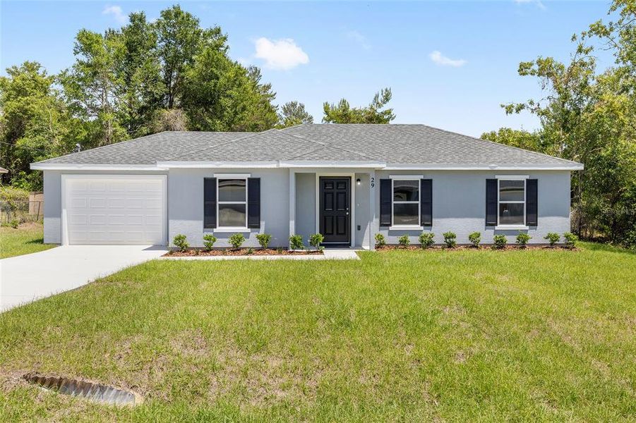 Front exterior of a new home in , Ocala, FL, highlighting curb appeal (Image 16).