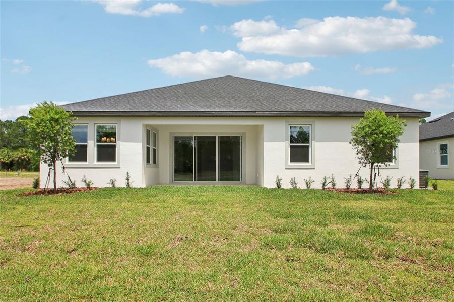 Exterior details and patio area of a home in Ridgehaven - Reserve Series, Ormond Beach (Image 20).