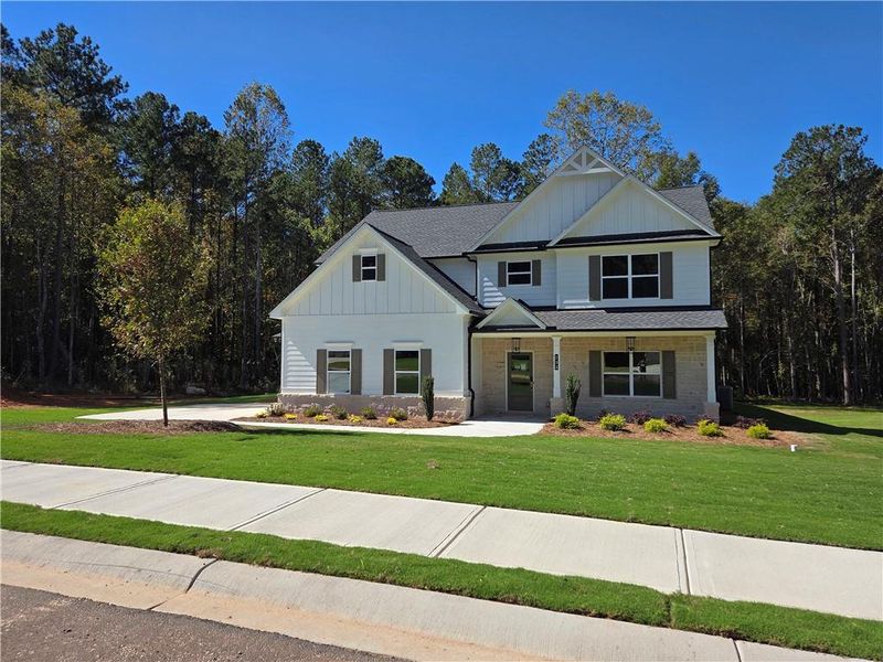 Front exterior of a new home in River Meadows, Bethlehem, GA, highlighting curb appeal (Image 17).