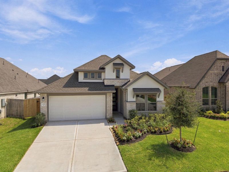 Front exterior of a new home in Escondido, Magnolia, TX, highlighting curb appeal (Image 22).