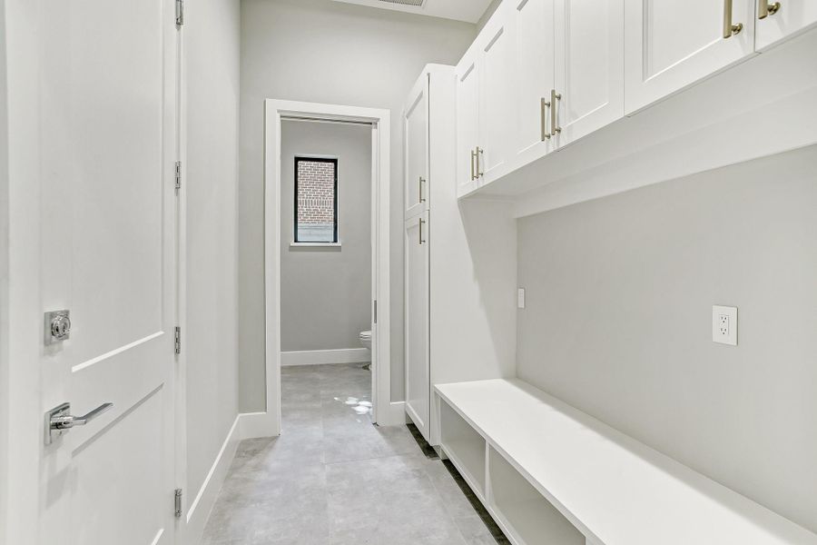 This convenient mud room can be entered from the garage or through the house and boosts of great cabinets, shelves and storage nooks. This convenient mud room can be entered from the garage or through the house and boosts of great cabinets, shelves and storage nooks.