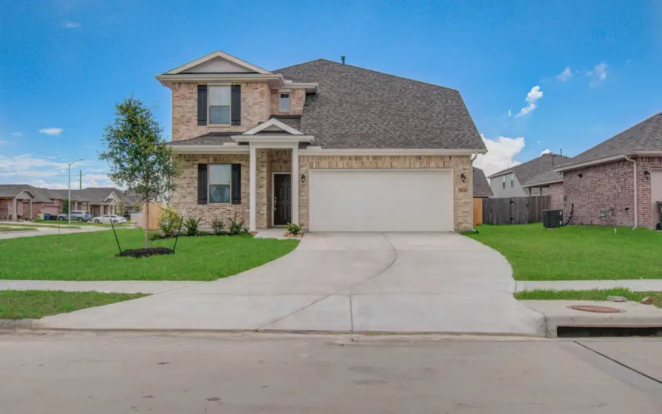 Front exterior of a new home in Legends Bay, Baytown, TX, highlighting curb appeal (Image 20).