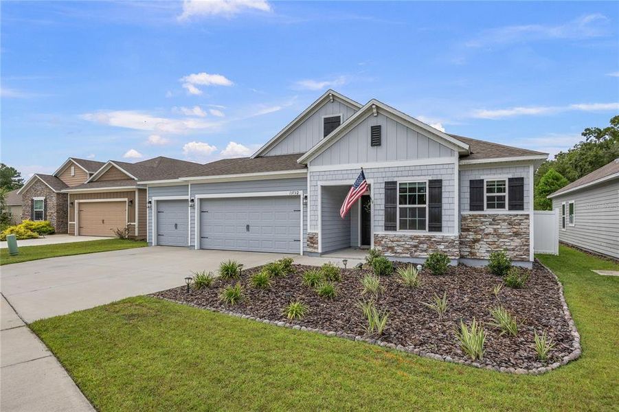 Front exterior of a new home in , Newberry, FL, highlighting curb appeal (Image 23).