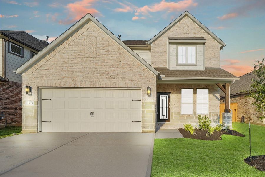 Front exterior of a new home in Sunterra, Katy, TX, highlighting curb appeal (Image 12).