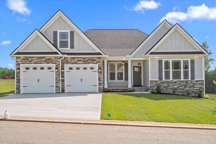 Representative exterior photo of a completed home built from the Hartford Elite by Enchanted Homes in Pointe Summit, Slater-Marietta, SC (Image 1).