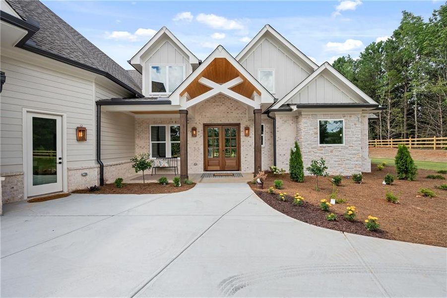 Front exterior of a new home in , Loganville, GA, highlighting curb appeal (Image 33). Front exterior of a new home in , Loganville, GA, highlighting curb appeal (Image 33).