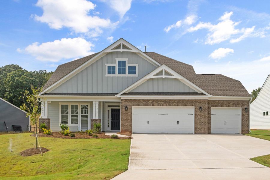 Front exterior of a new home in Grove Park, Clemmons, NC, highlighting curb appeal (Image 1). Front exterior of a new home in Grove Park, Clemmons, NC, highlighting curb appeal (Image 1).