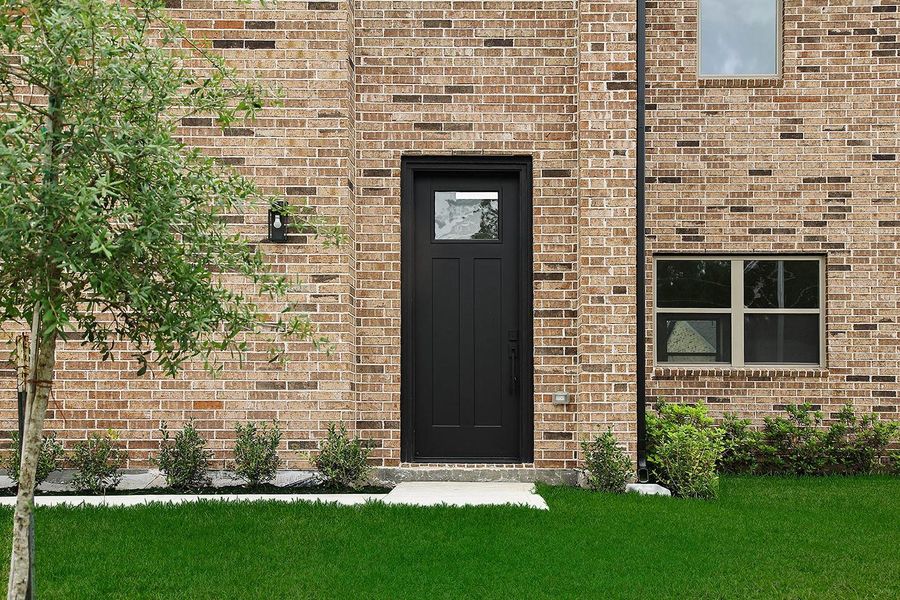 Exterior details and patio area of a home in , Spring (Image 3).