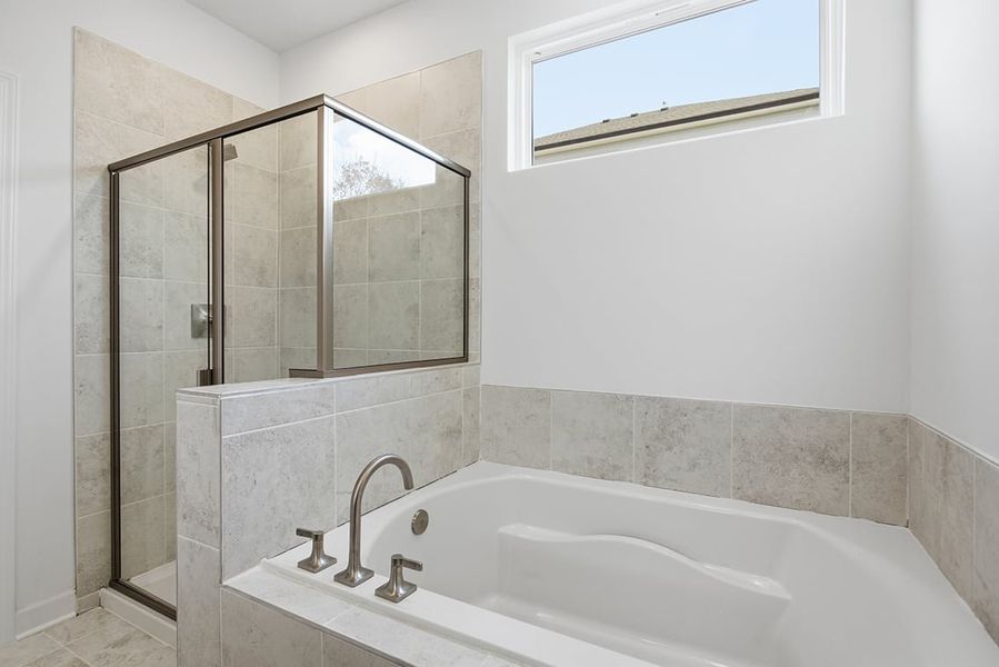 A bathroom with a glass shower. A bathroom with a glass shower.