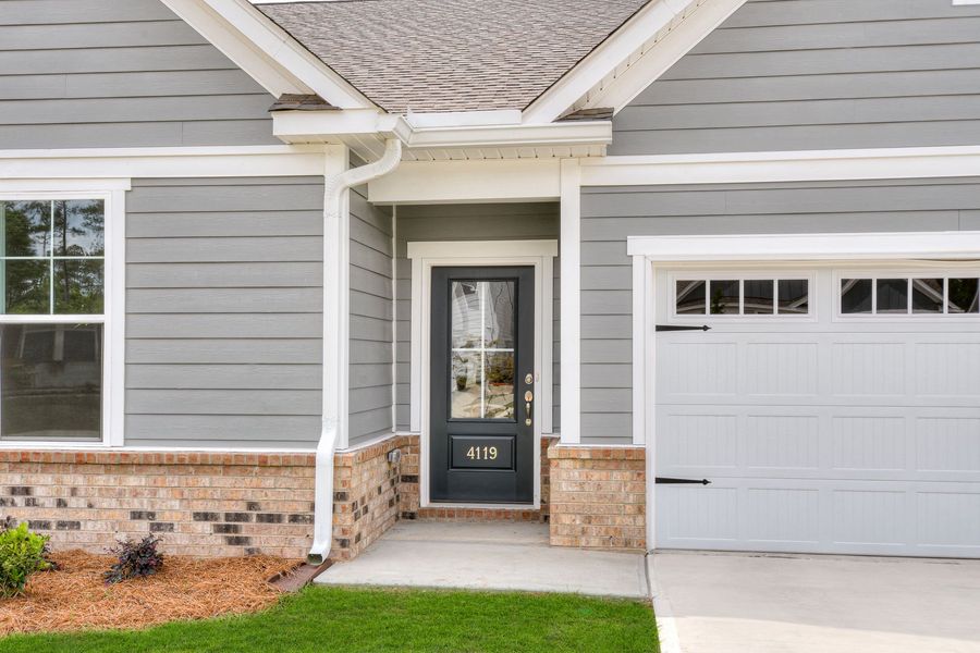 Exterior details and patio area of a home in The Beacon at Old Peachtree Single Family Homes, Lawrenceville (Image 67).