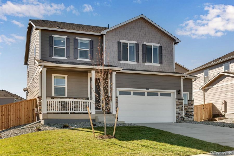 Front exterior of a new home in Trails at Crowfoot, Parker, CO, highlighting curb appeal (Image 24).