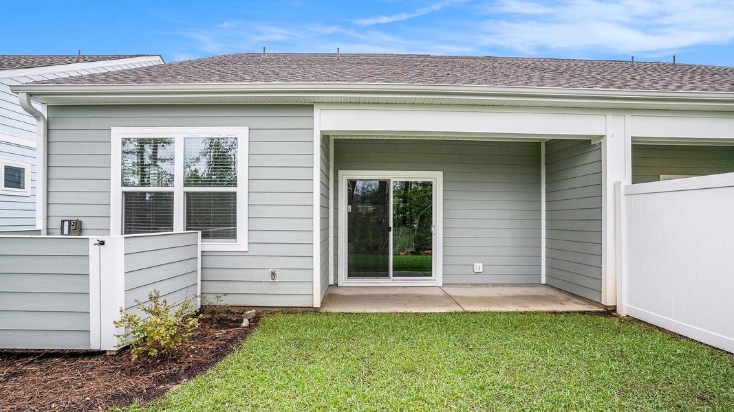 Exterior details and patio area of a home in Rich Square at Brunswick Plantation, Ash (Image 15). Exterior details and patio area of a home in Rich Square at Brunswick Plantation, Ash (Image 15).