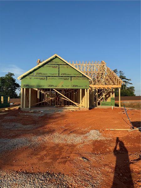 A new construction home with exposed framing offer