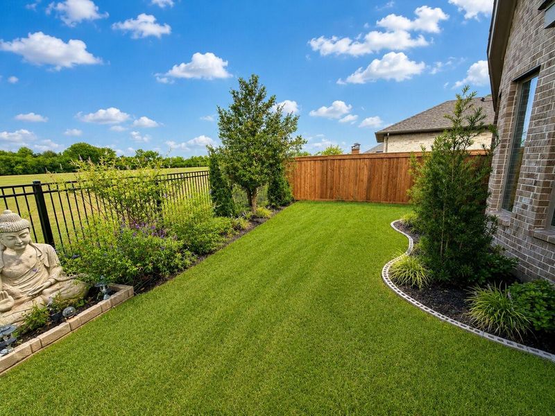 Exterior details and patio area of a home in Dunham Pointe, Cypress (Image 2). Exterior details and patio area of a home in Dunham Pointe, Cypress (Image 2).