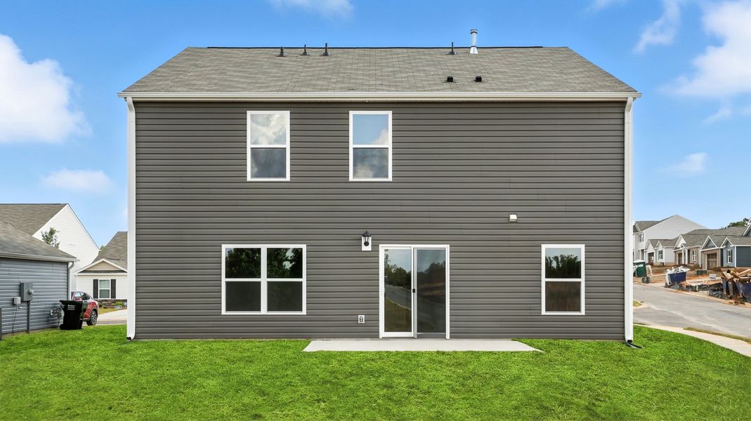 Front exterior of a new home in Treemont Commons, Wellford, SC, highlighting curb appeal (Image 2). Front exterior of a new home in Treemont Commons, Wellford, SC, highlighting curb appeal (Image 2).