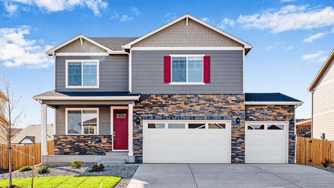 Front exterior of a new home in Trails at Crowfoot, Parker, CO, highlighting curb appeal (Image 20).